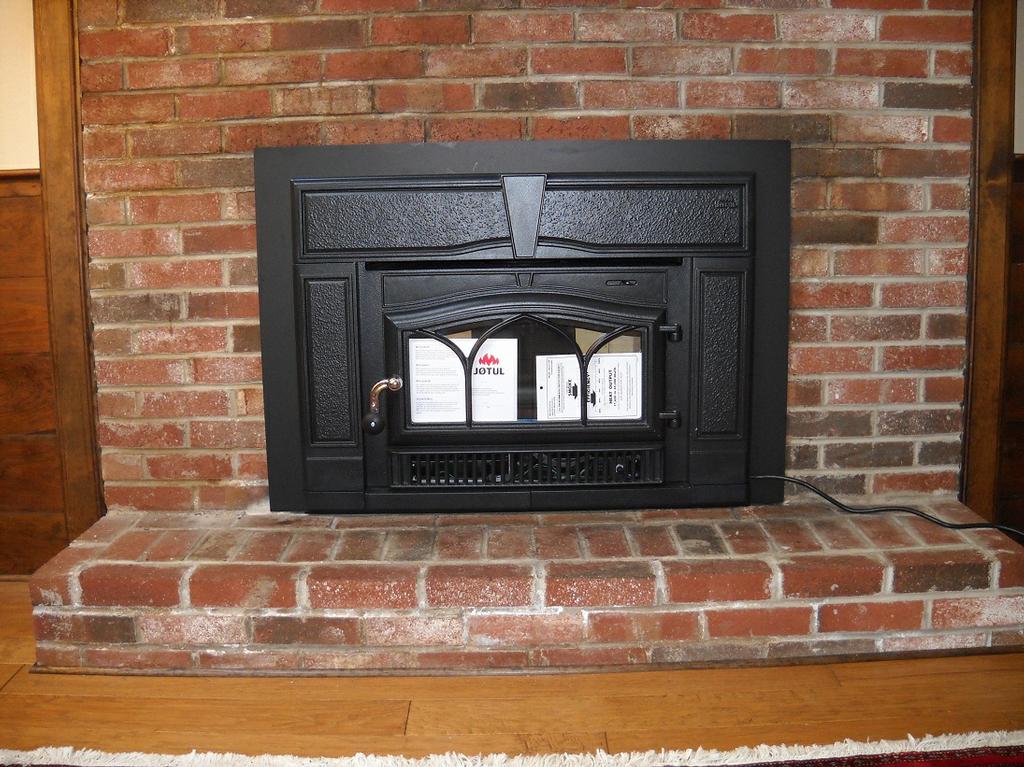 Jotul Wood Stove Insert Installed in Fireplace from Fireplace Village